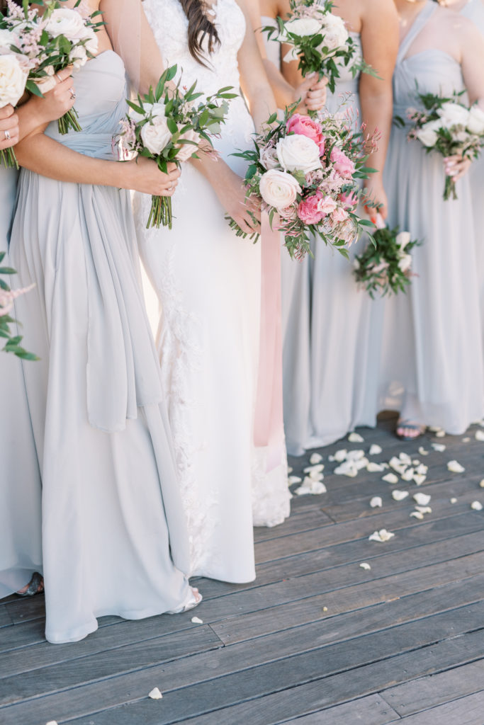Bride and bridal party, flower bouquests captured by wedding photographer in the finger lakes 