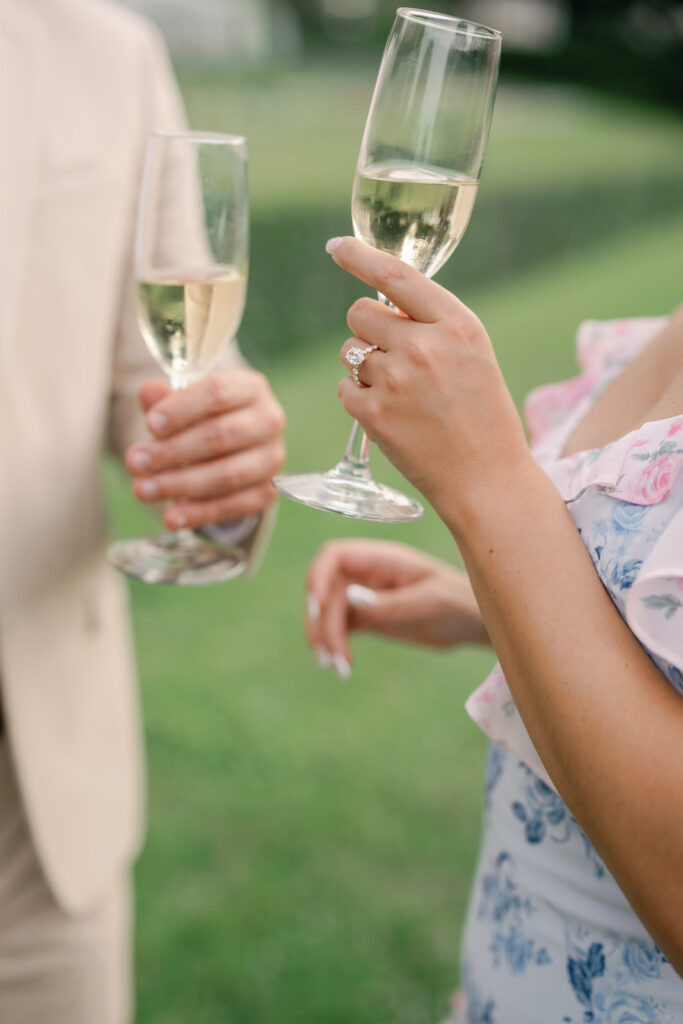 newly engaged couple cheers on seneca lake wedding venue